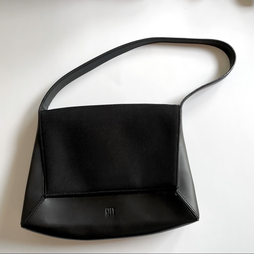 City DKNY small black purse with magnetic closure and inside zipper pocket